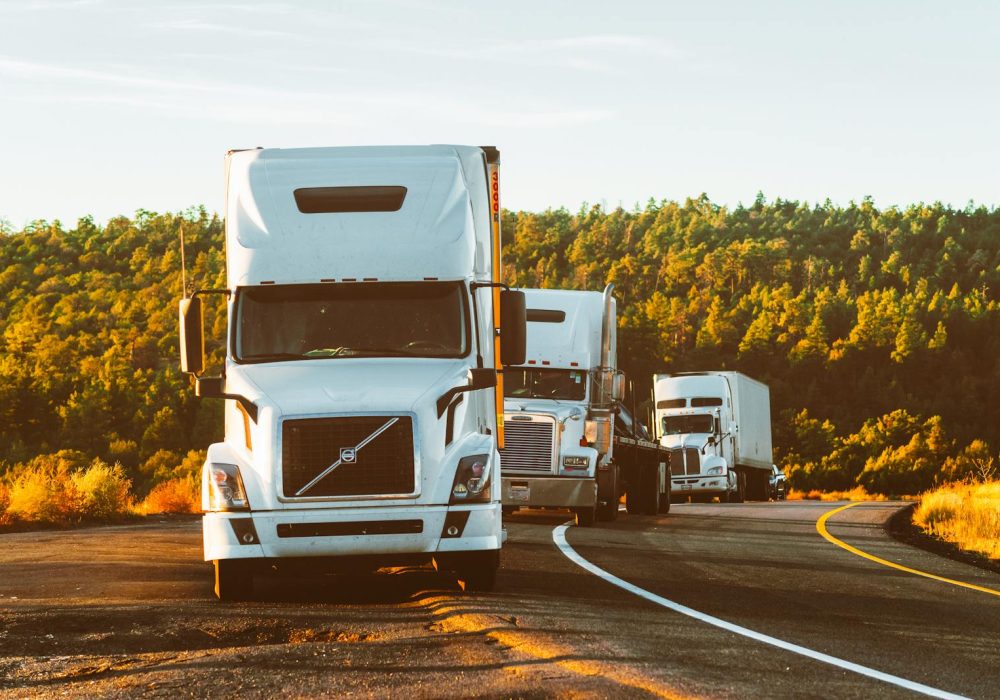 Photo by Quintin Gellar White Volvo Semi-truck on Side of Road