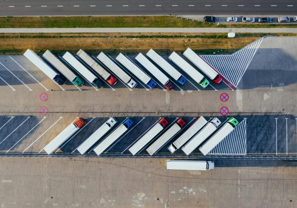 Photo by Marcin Jozwiak Aerial Photography Of Trucks Parked